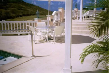 Exterior light pink stone finish 12" tile and pool coping