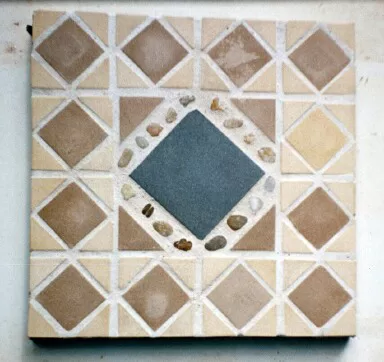 Mosaic with tile and beach stones