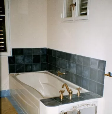 Dark blue 8" wall tile and 6" X 8" bullnose dark blue border