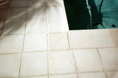 12" stone finished tile and pool coping
