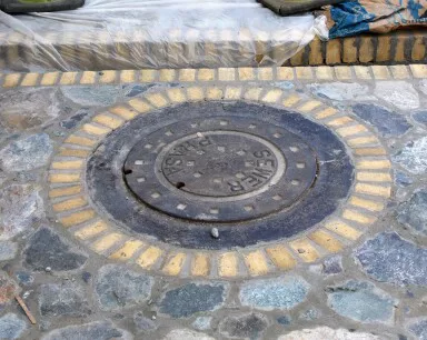 Vehicular brick pieces in St Thomas roadbed