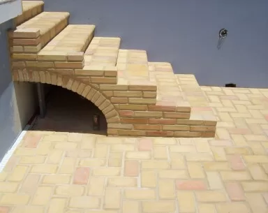 Arched stairs over pool plumbing