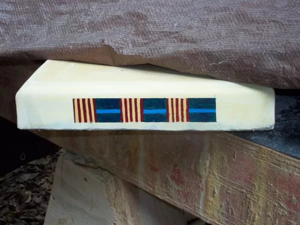 Kente cloth patterns painted on edges of benches and tables